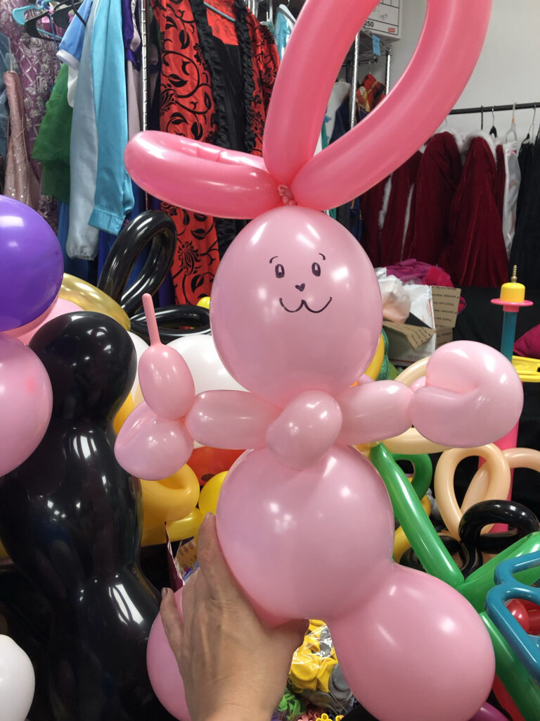 A pink balloon twisting bunny, designed by the twisters at Face Painter NH