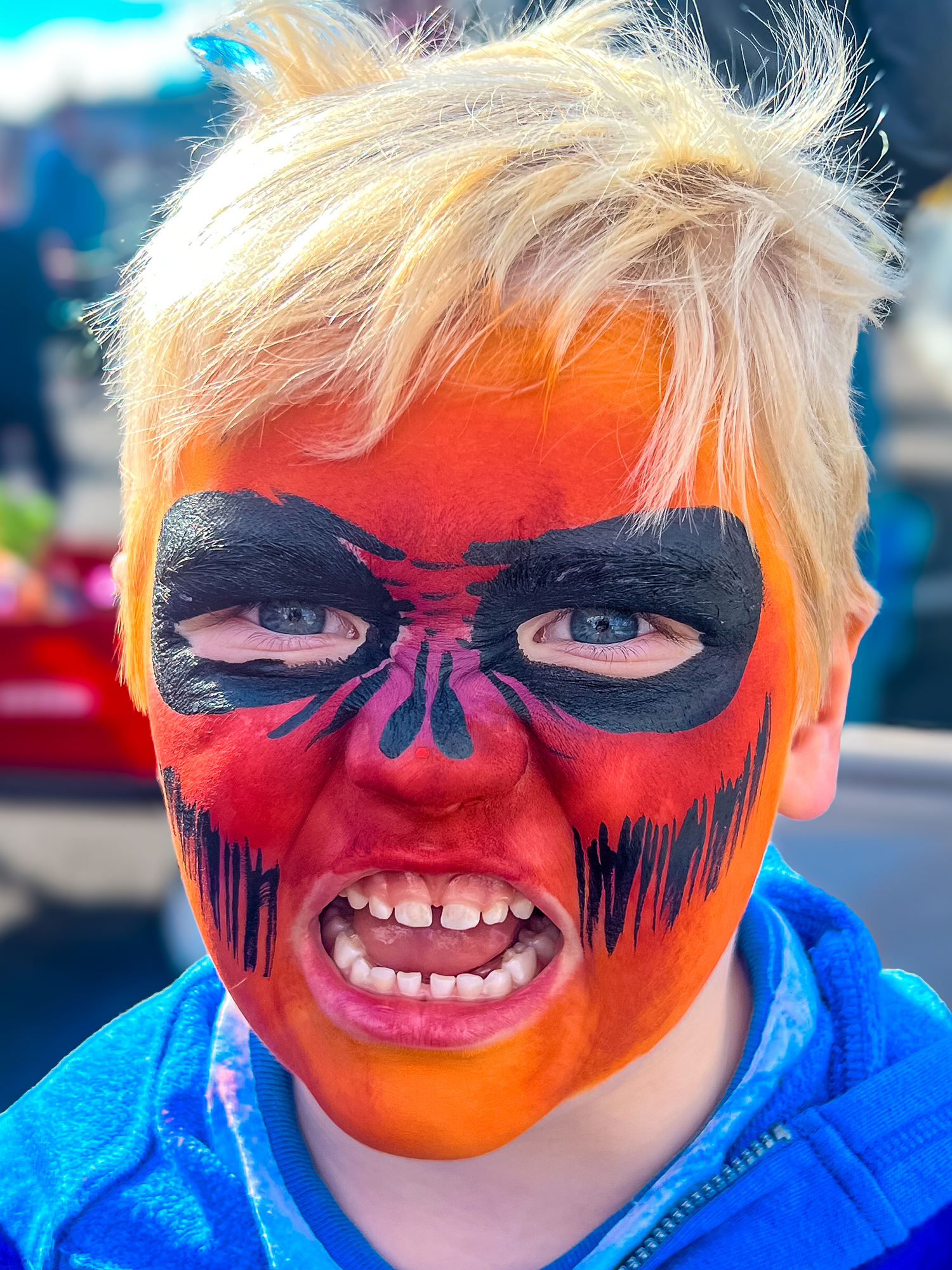 Boy with a scary face painting design